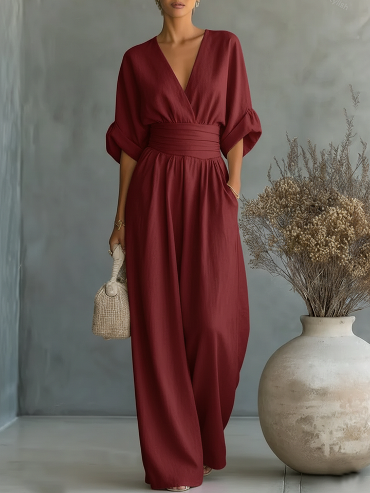 Elegante mono con escote en V, cintura alta y pierna ancha