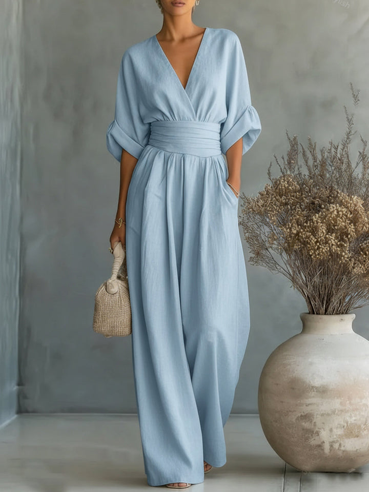 Elegante mono con escote en V, cintura alta y pierna ancha