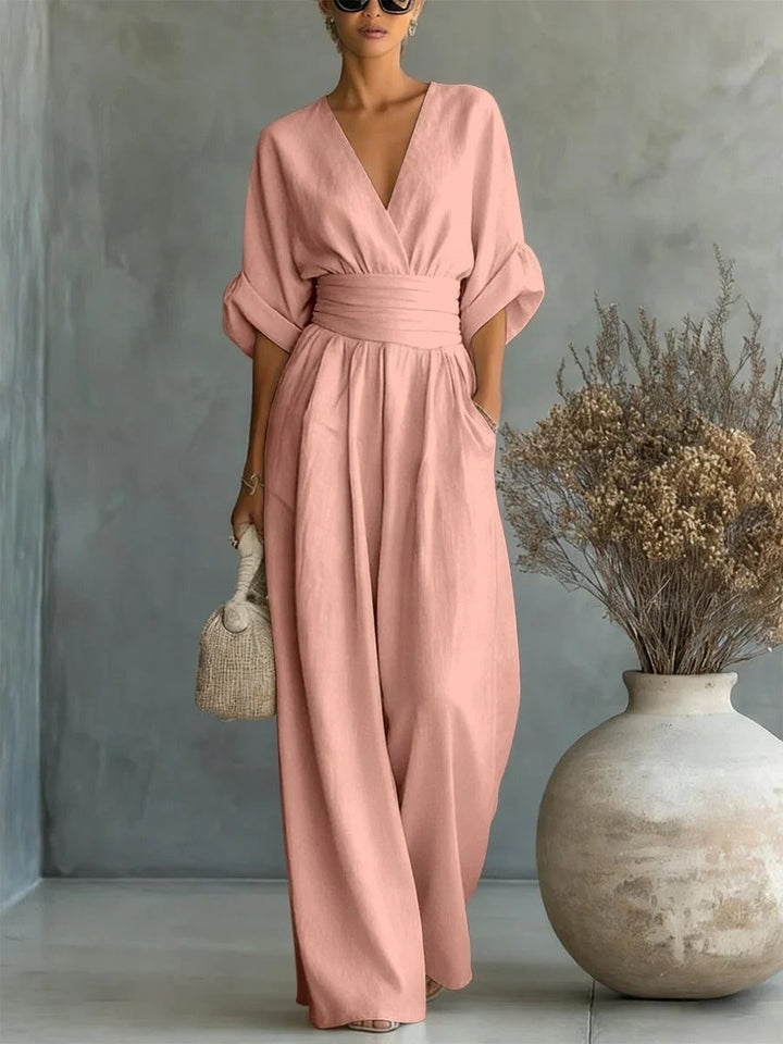 Elegante mono con escote en V, cintura alta y pierna ancha